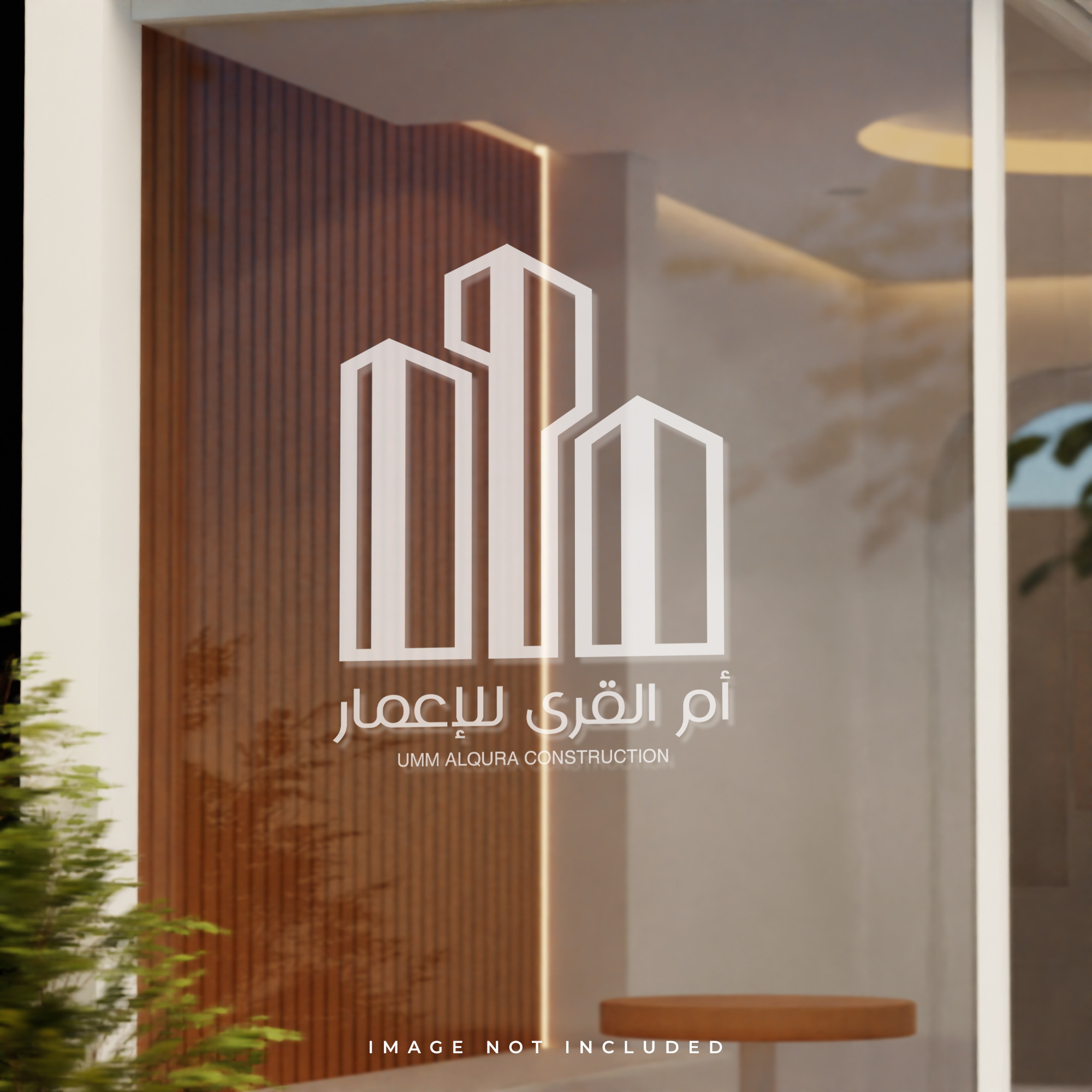 Um Alqura Construction mark on an interior glass wall